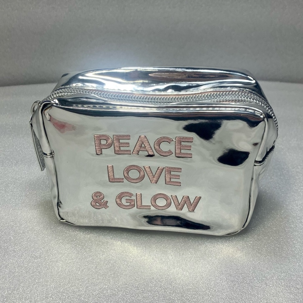 NWT Beauty Bio Silver Metallic Makeup Bag with Pink Text! Peace Love & Glow!